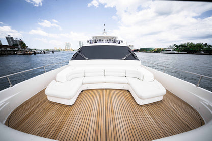 Curved white bow seating overlooking the water